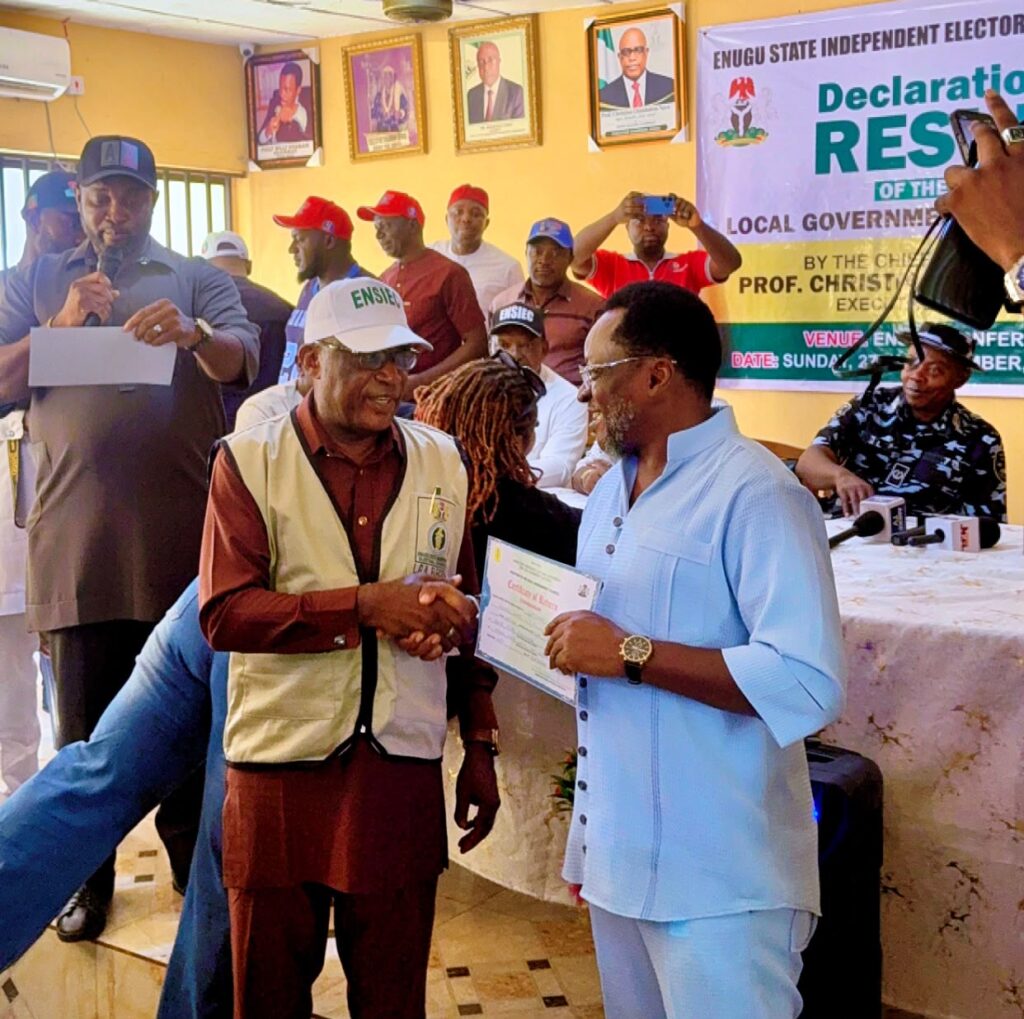 Ogbuekwe receiving his certificate of return from the ENSIEC Chairman Prof Ngwu